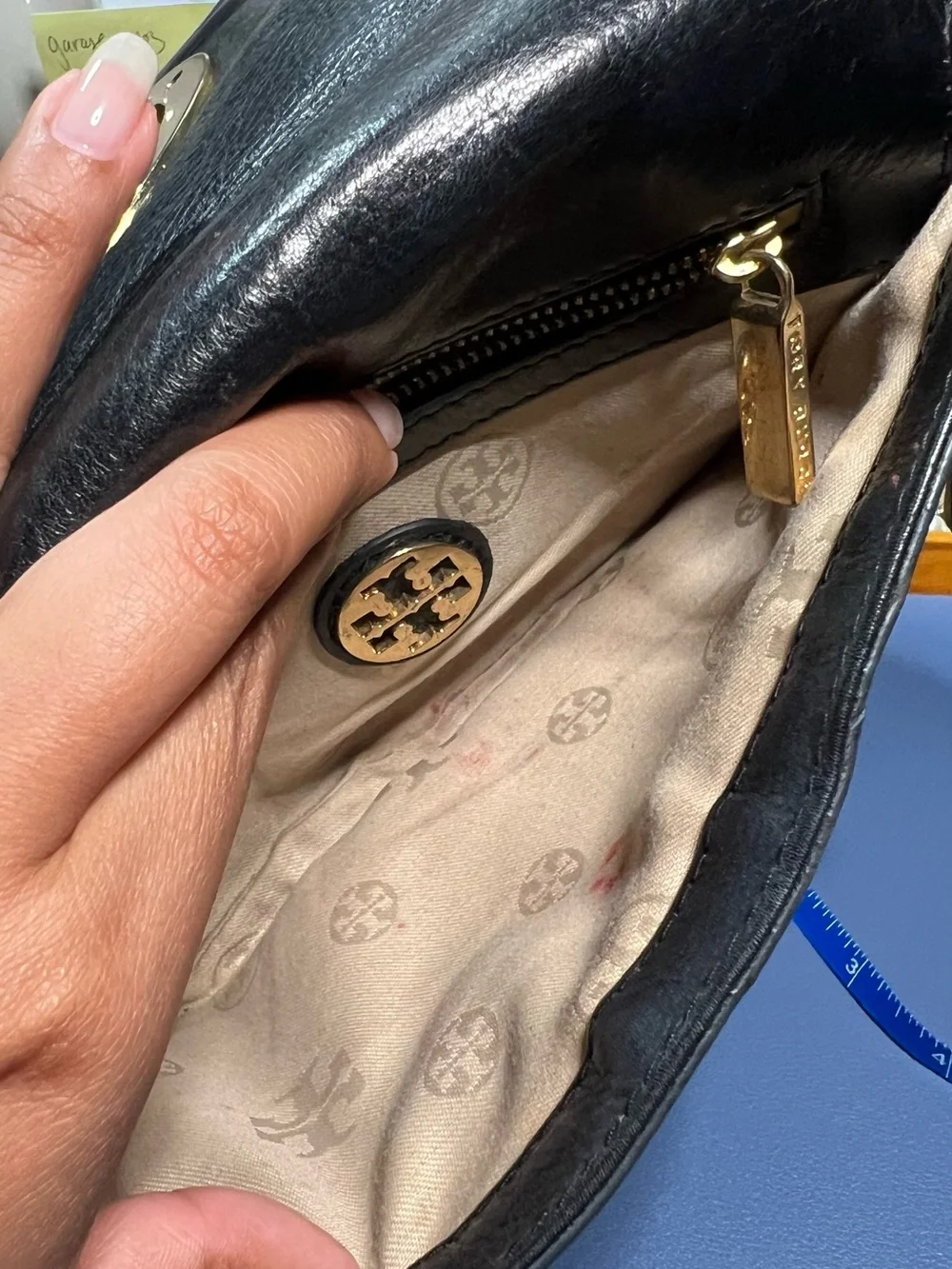 Pre-loved Tory Burch Black Leather clutch with Gold hardware